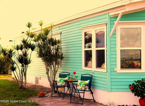 a view of swimming pool with a table and chairs
