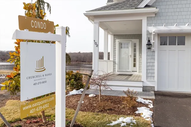 a sign board with a small yard