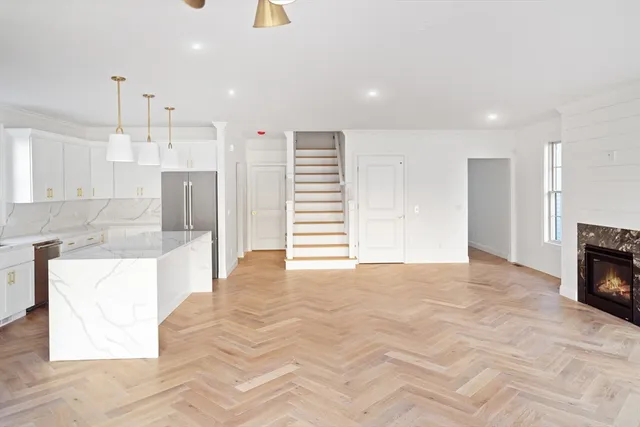 a view of a kitchen with a sink and cabinets