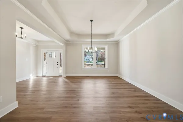 a kitchen with a sink and chandelier