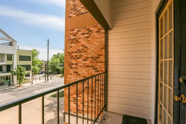 a view of balcony with furniture