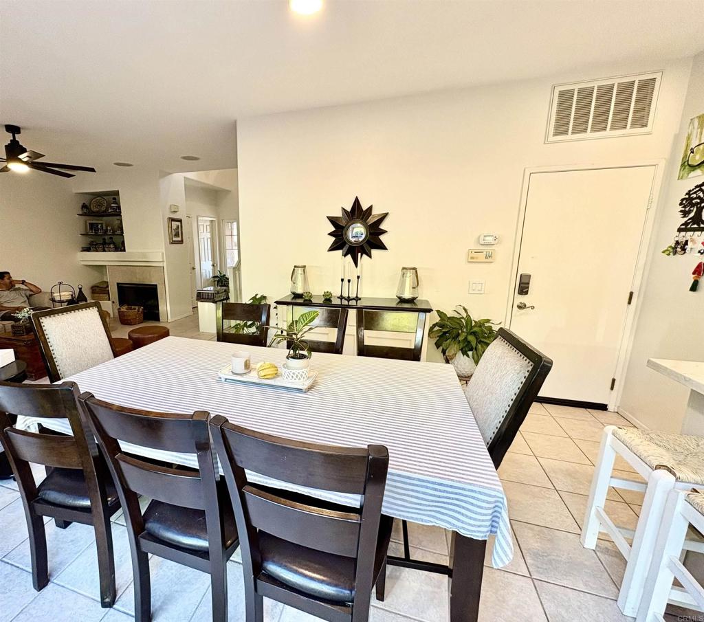 2879 Bear Valley Road Chula Vista, CA 91915 - Photo 11 of 61 a view of a dining room with furniture and wooden floor