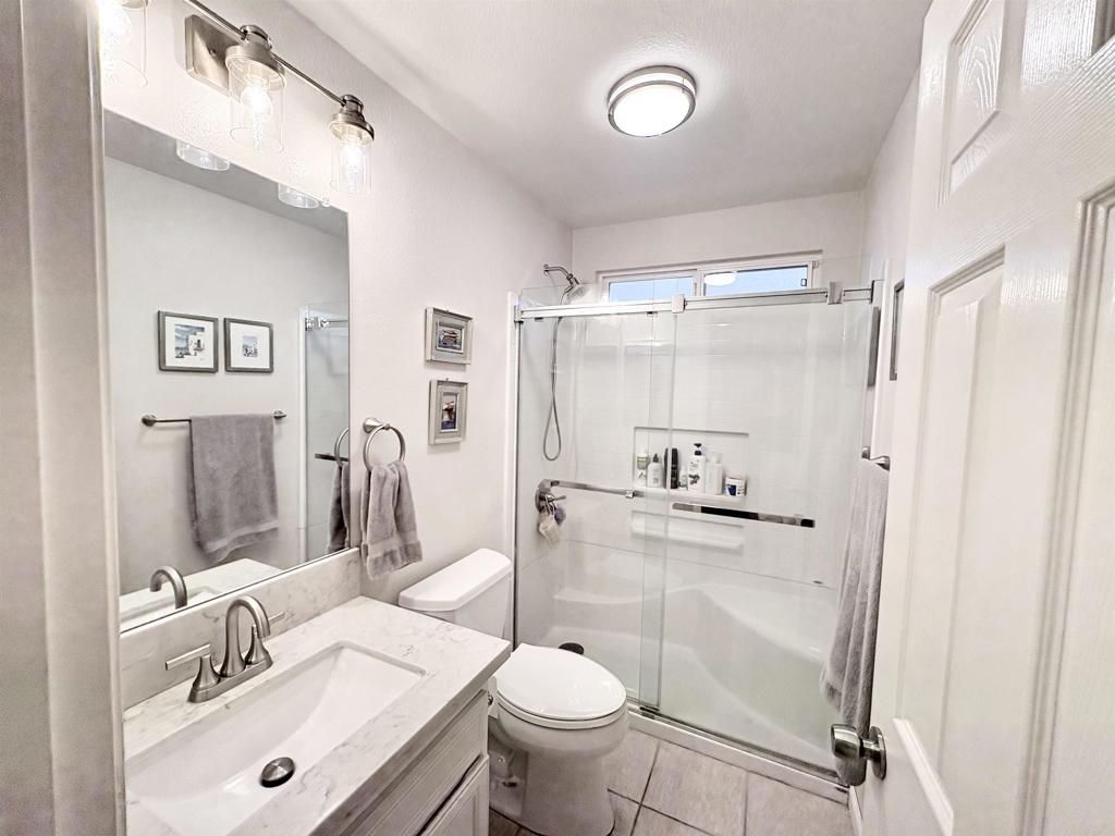 2879 Bear Valley Road Chula Vista, CA 91915 - Photo 32 of 61 a bathroom with a sink toilet and shower