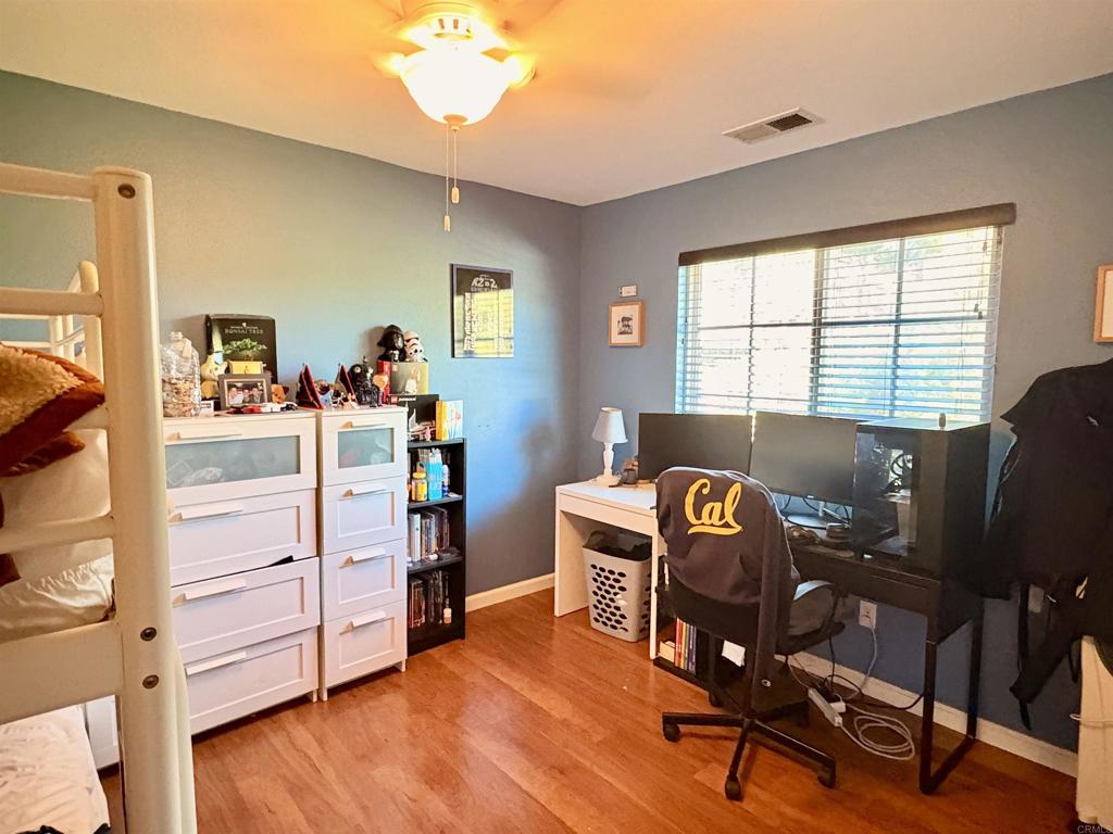 2879 Bear Valley Road Chula Vista, CA 91915 - Photo 35 of 61 a view of a workspace with furniture and a window