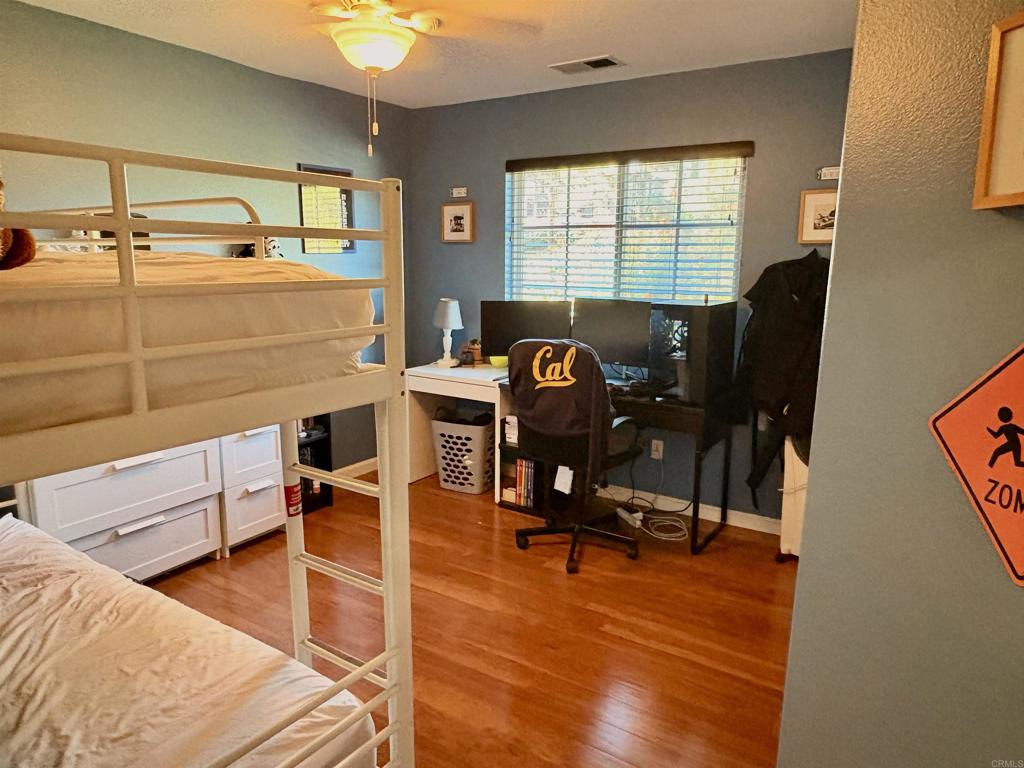 2879 Bear Valley Road Chula Vista, CA 91915 - Photo 36 of 61 a view of a workspace with furniture and a window