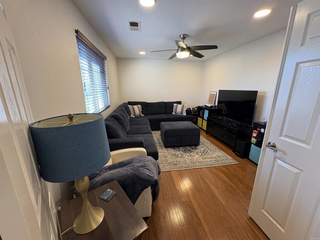 2879 Bear Valley Road Chula Vista, CA 91915 - Photo 52 of 61 a living room with furniture and a flat screen tv