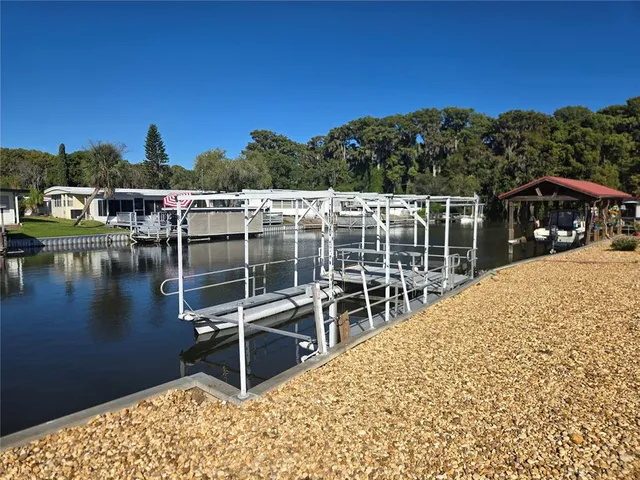 a view of a swimming pool with seating area