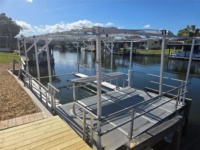a view of a balcony with two chairs and a table