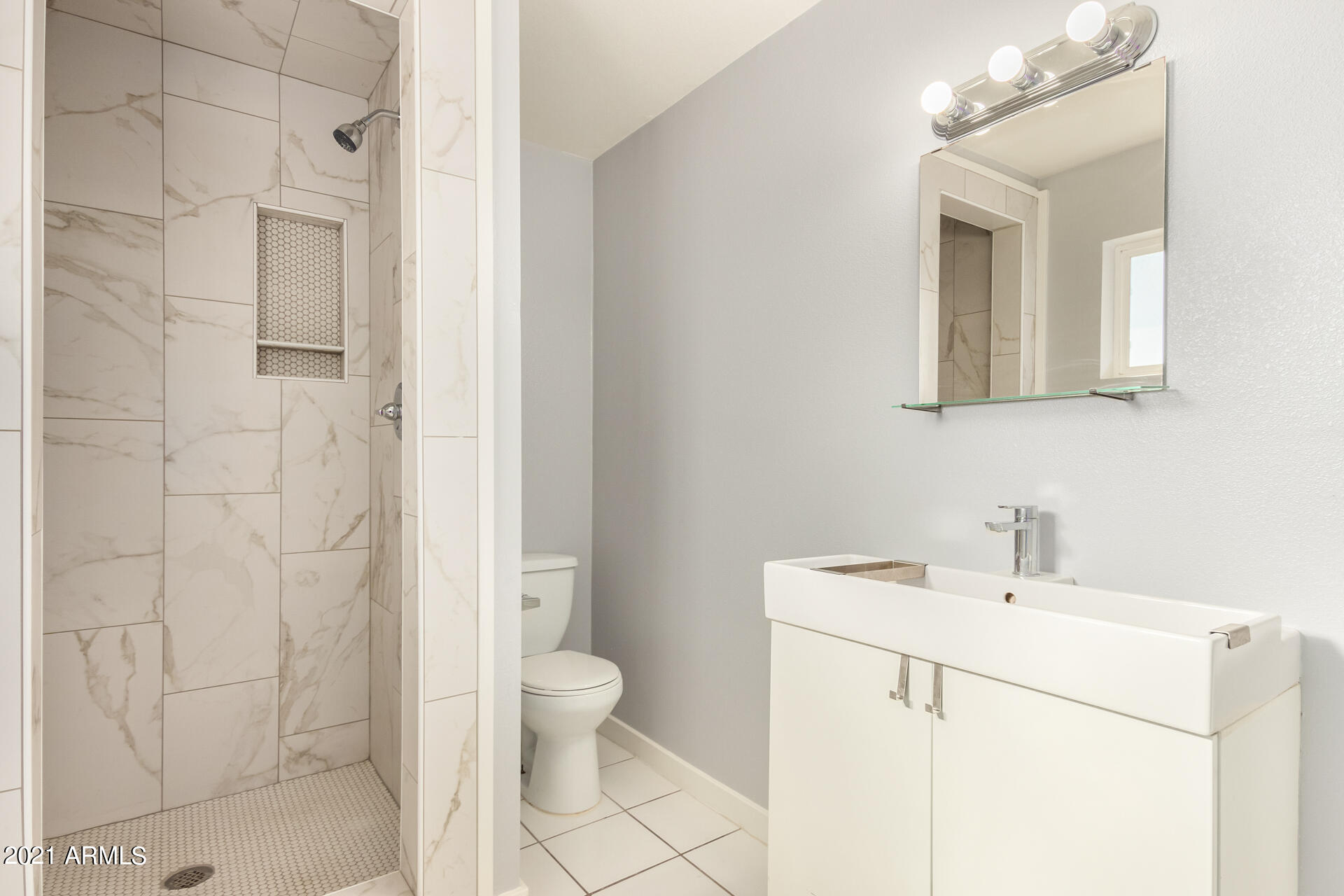 803 West Elna Rae Street Tempe, AZ 85281 - Photo 22 of 28 a bathroom with a sink a toilet and shower