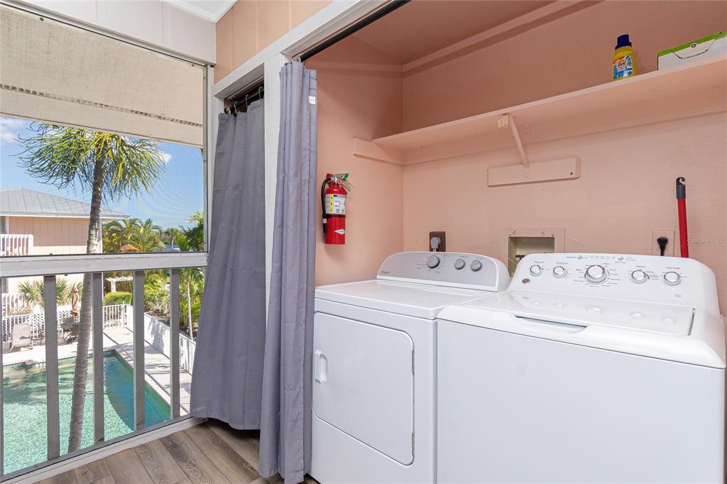 2375 North Beach Road, Unit 2B Englewood, FL 34223 - Photo 19 of 44 a utility room with dryer and washer