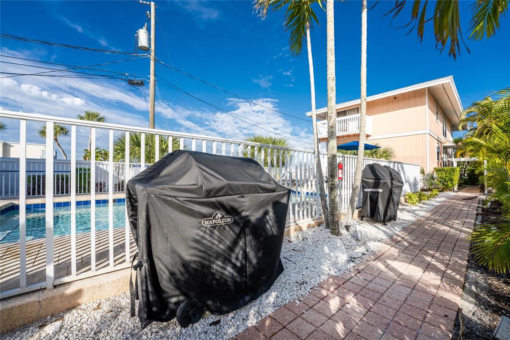 2375 North Beach Road, Unit 2B Englewood, FL 34223 - Photo 31 of 44 a view of a porch with a table and chairs