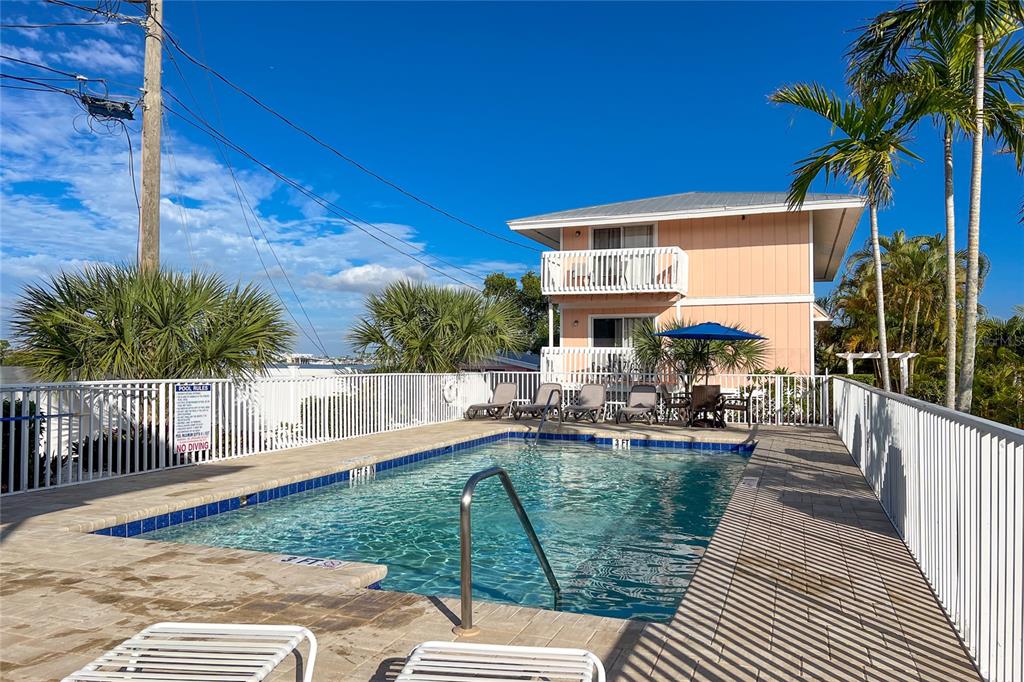 2375 North Beach Road, Unit 2B Englewood, FL 34223 - Photo 32 of 44 a view of a house with backyard and sitting area