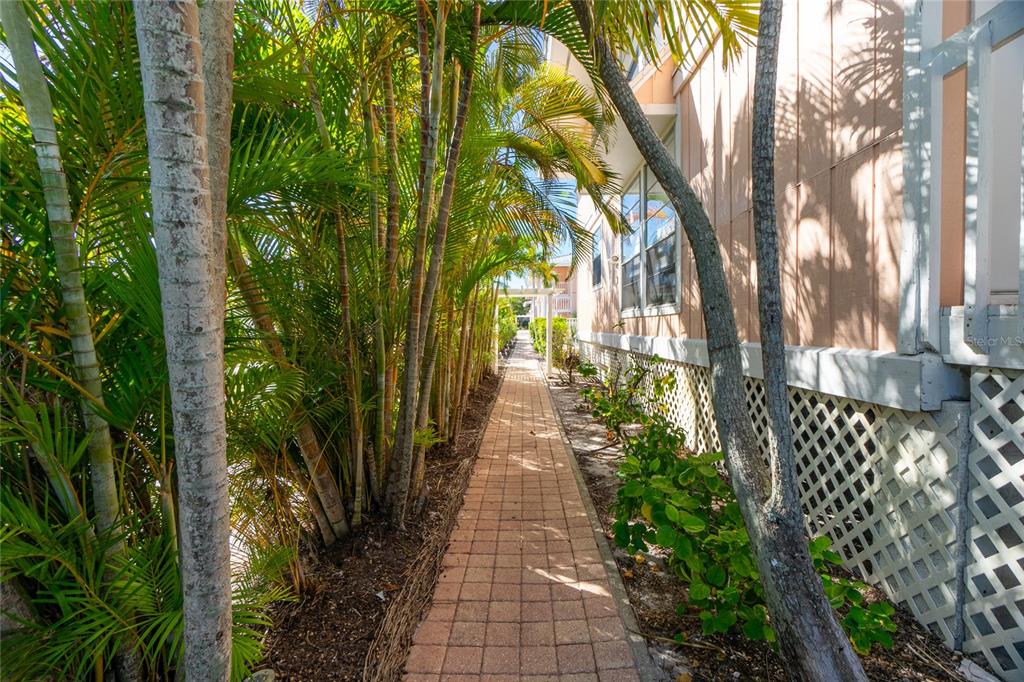 2375 North Beach Road, Unit 2B Englewood, FL 34223 - Photo 36 of 44 a view of a pathway with a garden