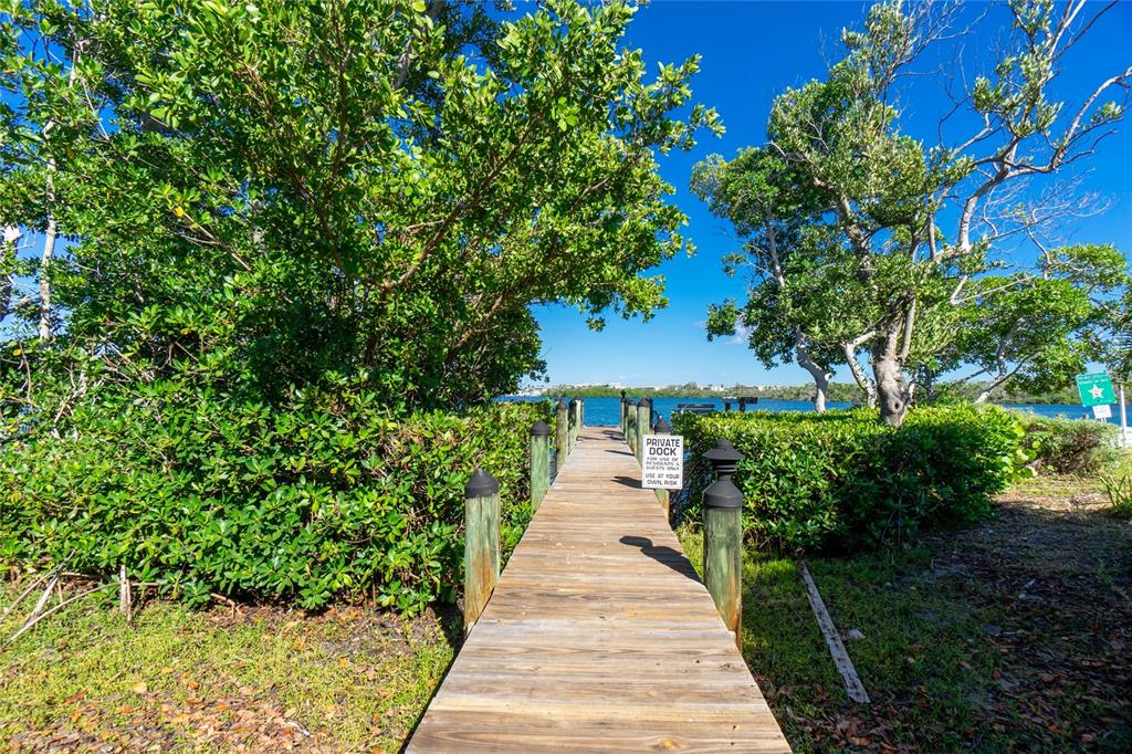 2375 North Beach Road, Unit 2B Englewood, FL 34223 - Photo 38 of 44 a view of a garden with pathway