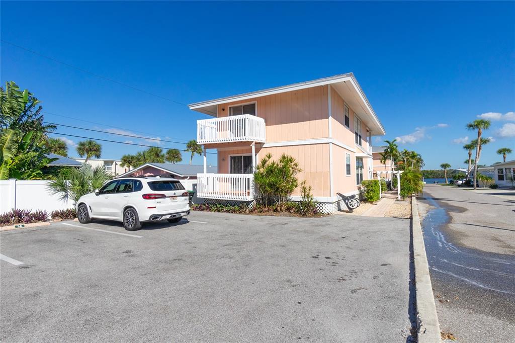 2375 North Beach Road, Unit 2B Englewood, FL 34223 - Photo 41 of 44 a view of a car parked in front of a house