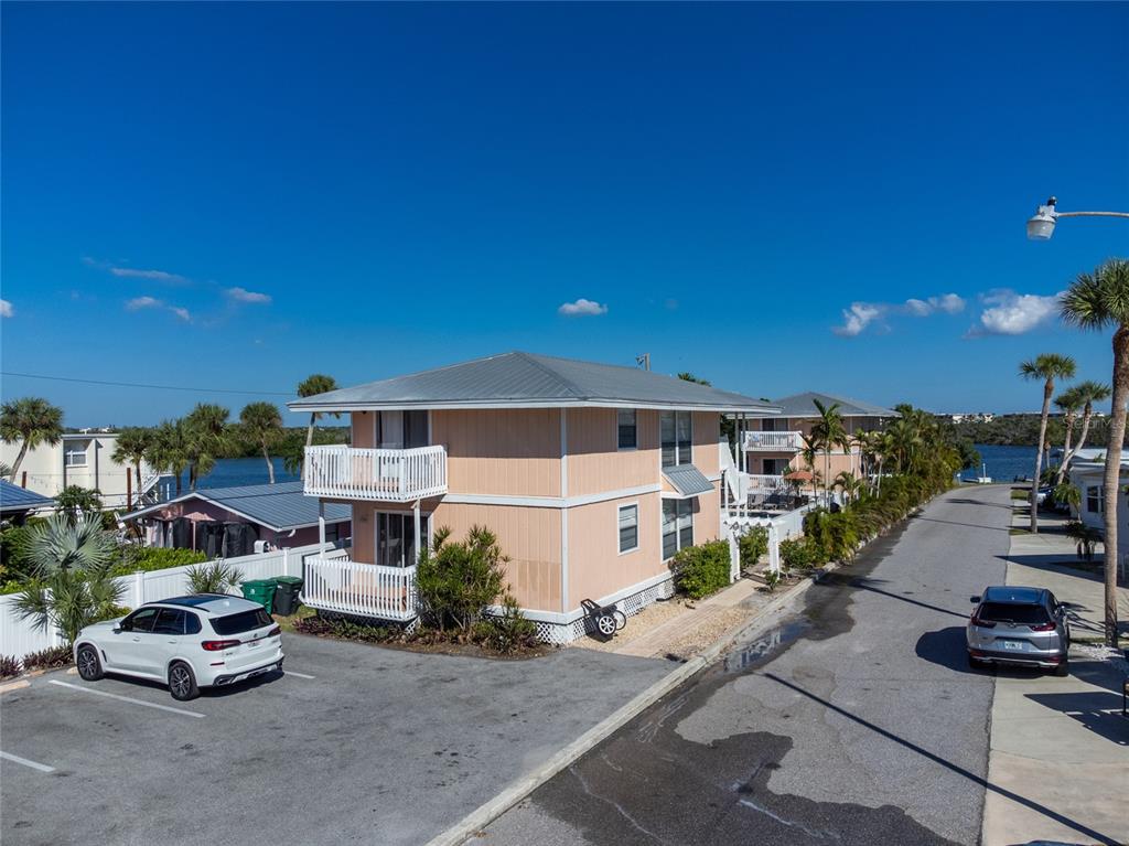2375 North Beach Road, Unit 2B Englewood, FL 34223 - Photo 42 of 44 a car parked in front of a building