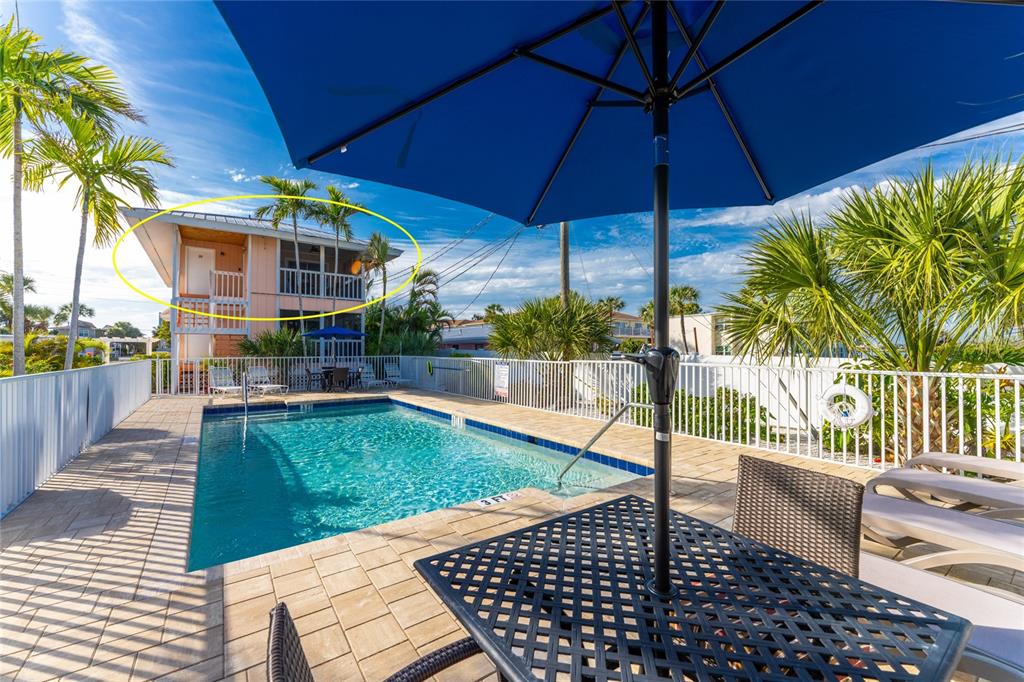 2375 North Beach Road, Unit 2B Englewood, FL 34223 - Photo 5 of 44 a view of a swimming pool with a patio