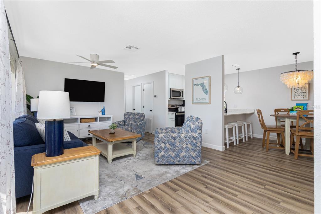 2375 North Beach Road, Unit 2B Englewood, FL 34223 - Photo 7 of 44 a living room with furniture and a flat screen tv