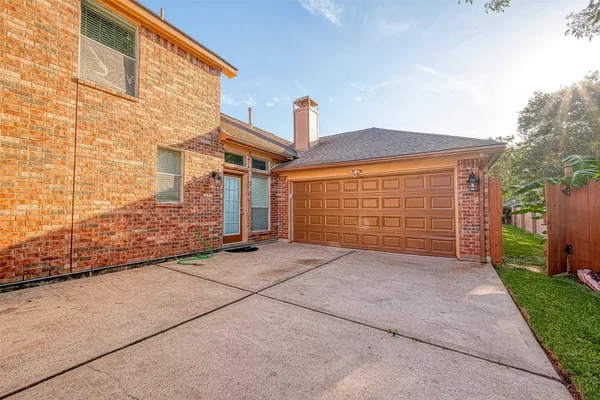 a view of backyard of house and garage