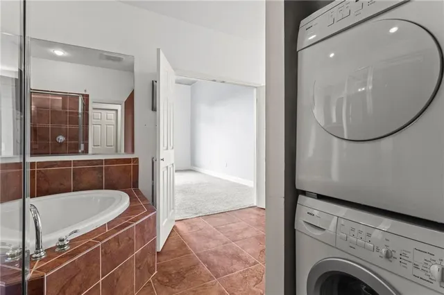 a view of a bathroom with a tub and mirror