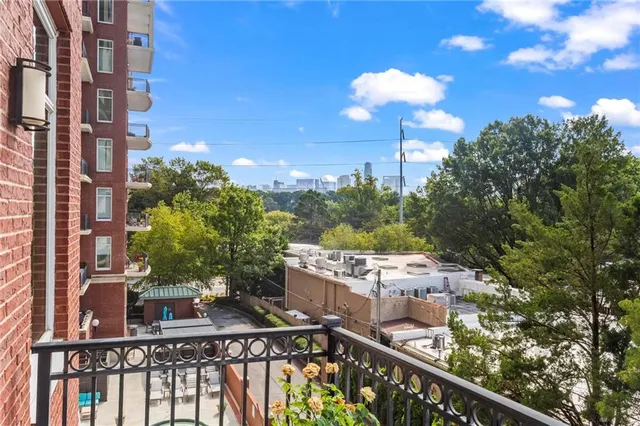 a view of a balcony with an outdoor seating