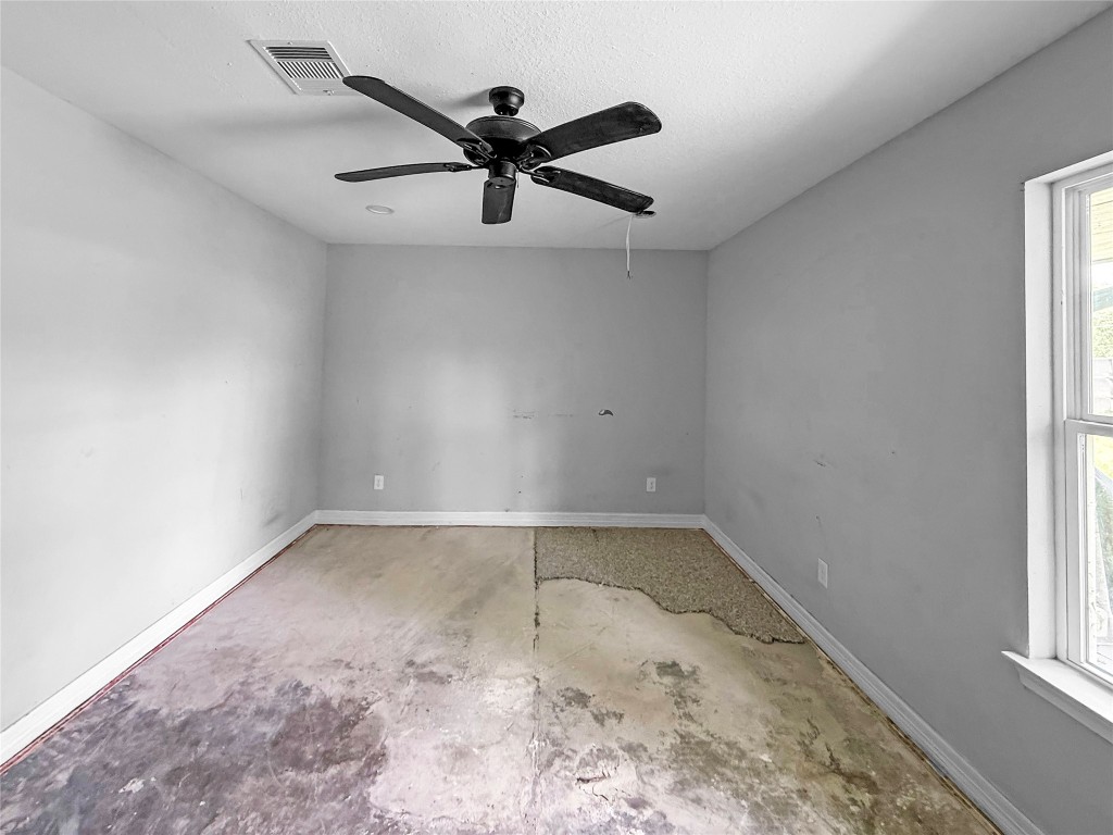 3706 Roberts Boulevard Baytown, TX 77521 - Photo 12 of 22 an empty room with a window and a fan