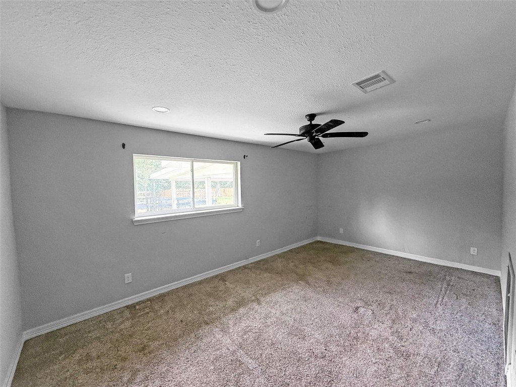 3706 Roberts Boulevard Baytown, TX 77521 - Photo 13 of 22 wooden floor in an empty room with a window