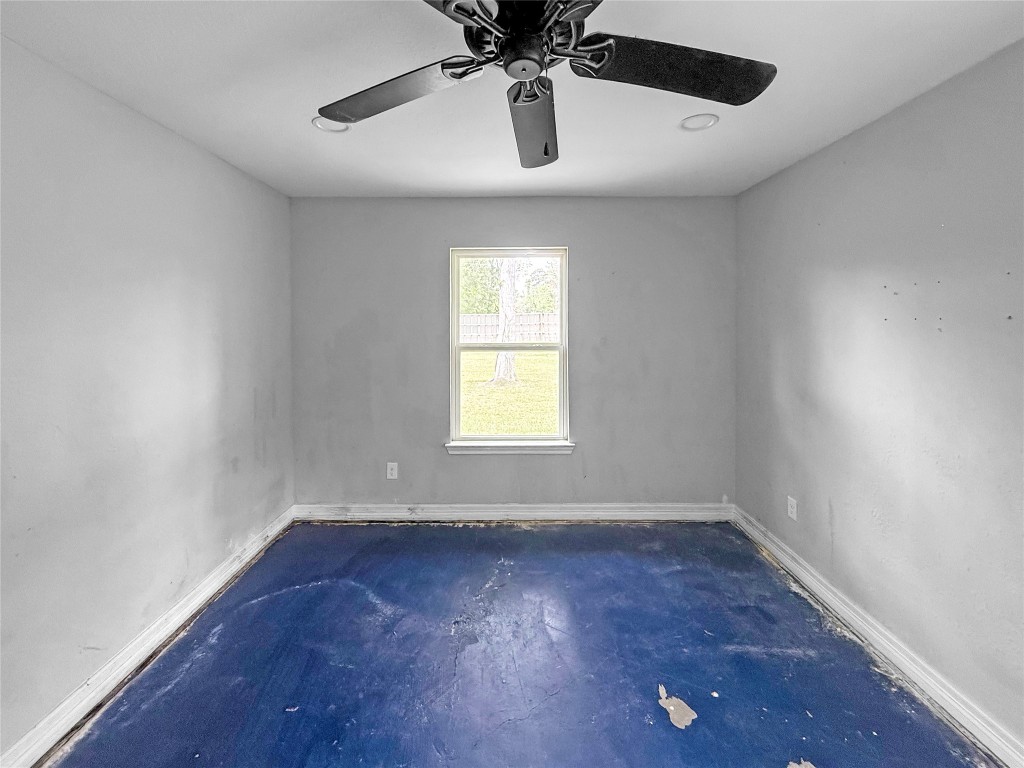 3706 Roberts Boulevard Baytown, TX 77521 - Photo 20 of 22 wooden floor in an empty room with a window