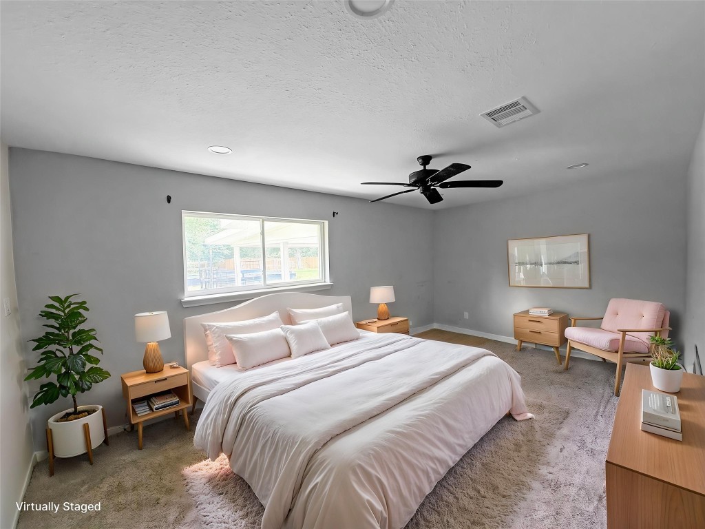 3706 Roberts Boulevard Baytown, TX 77521 - Photo 3 of 22 a bedroom with furniture and a window