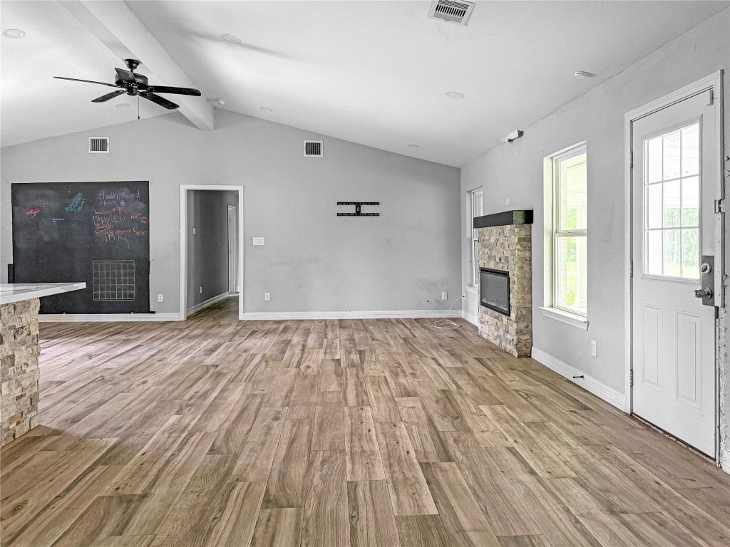 3706 Roberts Boulevard Baytown, TX 77521 - Photo 10 of 22 a view of empty room with wooden floor and fan