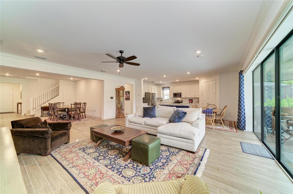 16341 Hidden Oak Loop Lakewood Ranch, FL 34211 - Photo 14 of 76 a living room with furniture and a wooden floor