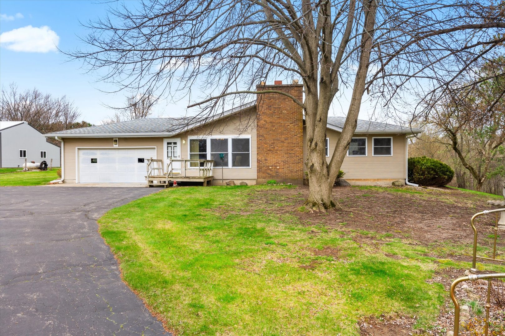 a front view of house with yard and green space