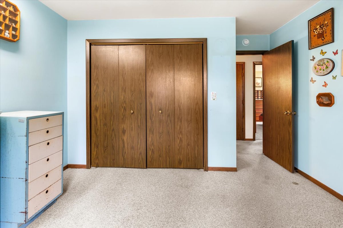 7112 Altenburg Road Harvard, IL 60033 - Photo 13 of 26 an empty room with windows and closet