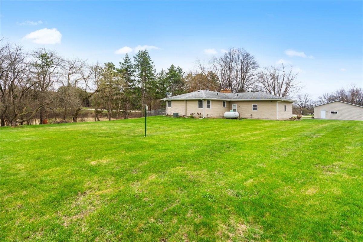 7112 Altenburg Road Harvard, IL 60033 - Photo 20 of 26 a view of a house with a yard
