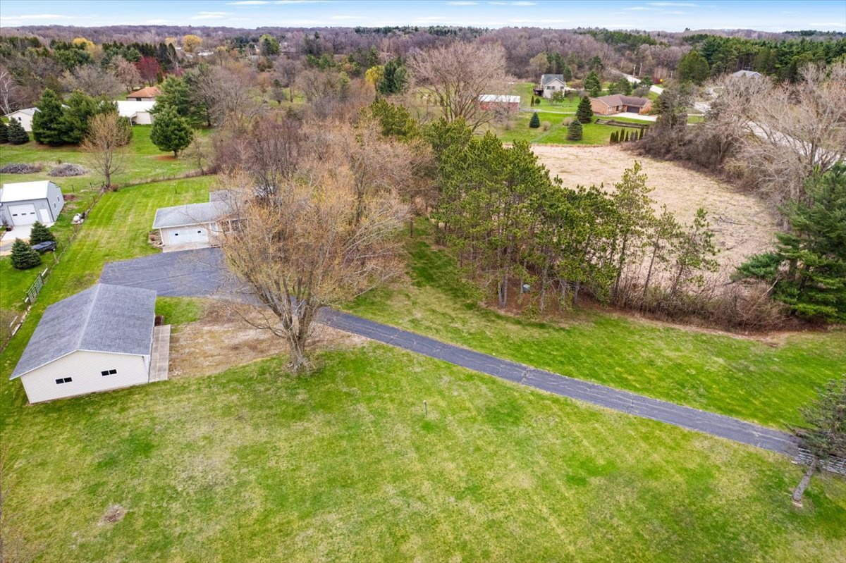 7112 Altenburg Road Harvard, IL 60033 - Photo 3 of 26 a view of a yard with large trees
