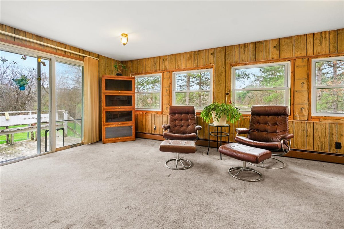 7112 Altenburg Road Harvard, IL 60033 - Photo 8 of 26 a view of a livingroom with workspace and a window