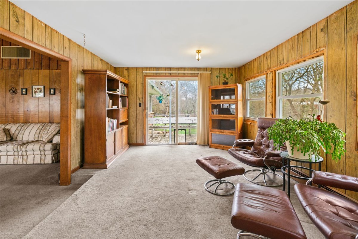 7112 Altenburg Road Harvard, IL 60033 - Photo 9 of 26 a living room with furniture and a large window