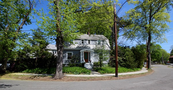 front view of a house with a garden