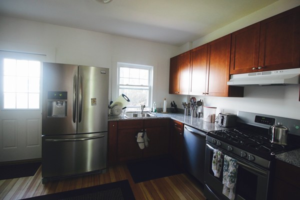 41 Katherine Road Watertown, MA 02472 - Photo 3 of 10 a kitchen with stainless steel appliances granite countertop a stove refrigerator and sink