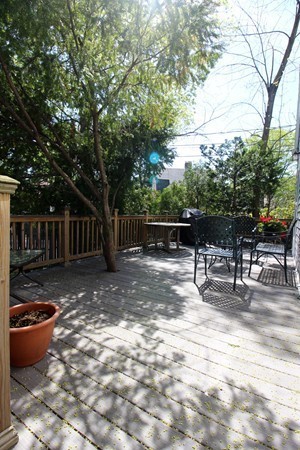 41 Katherine Road Watertown, MA 02472 - Photo 5 of 10 a view of backyard with table and chairs and wooden fence