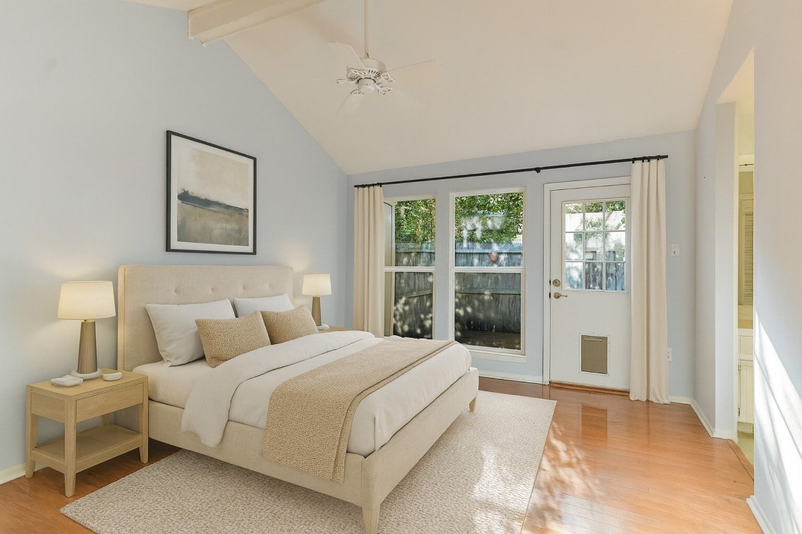 8151 Meandering Way Austin, TX 78759 - Photo 11 of 23 a bedroom with a large bed and a large window