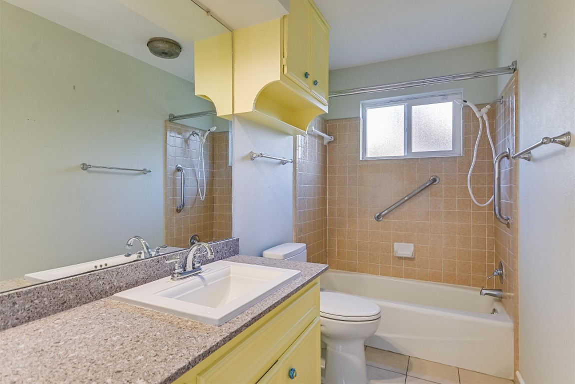 8151 Meandering Way Austin, TX 78759 - Photo 13 of 23 a bathroom with a granite countertop sink toilet and shower