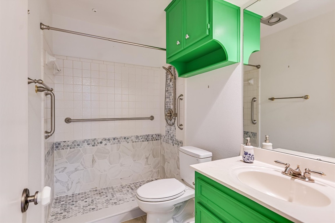 8151 Meandering Way Austin, TX 78759 - Photo 15 of 23 a bathroom with a sink toilet and shower