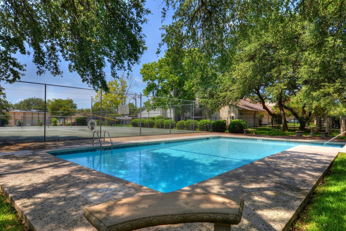 8151 Meandering Way Austin, TX 78759 - Photo 19 of 23 a view of a backyard with large trees