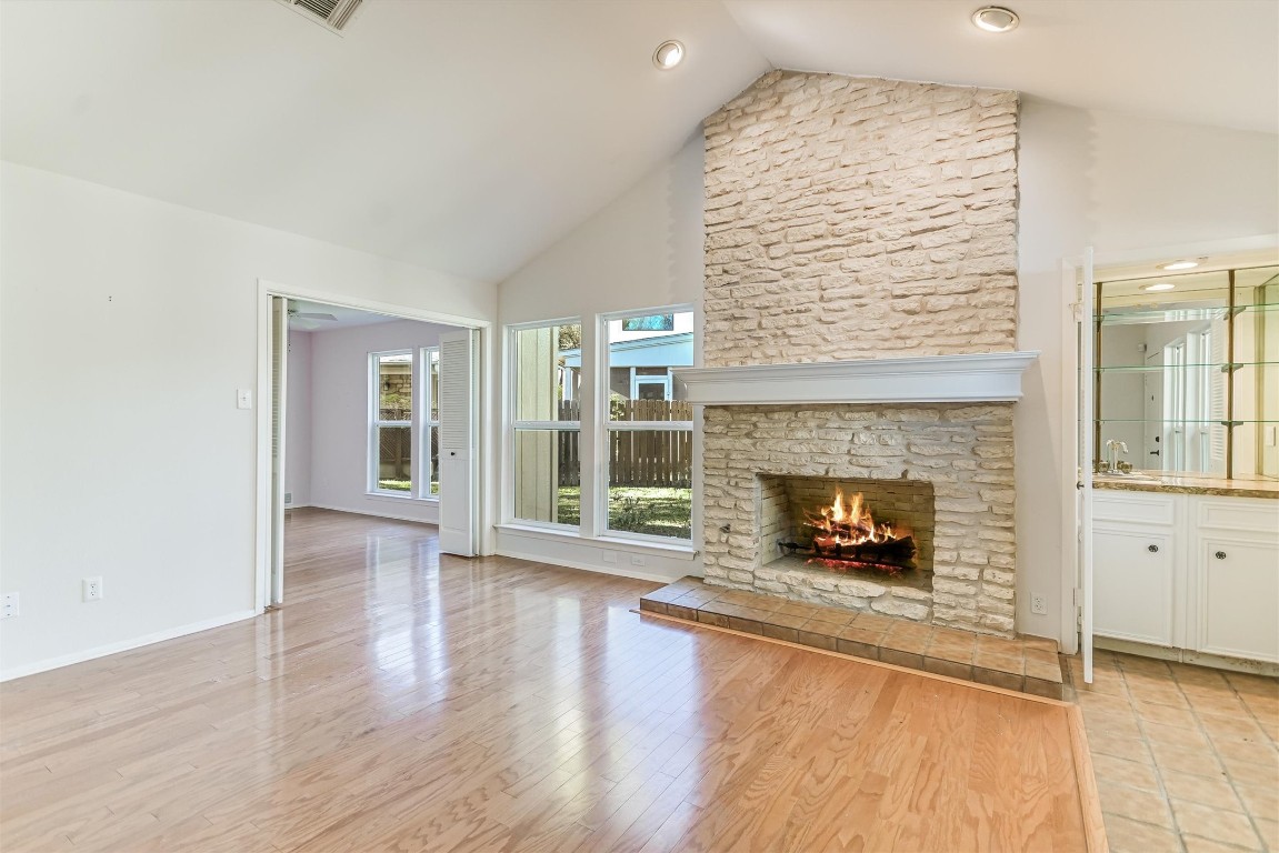 8151 Meandering Way Austin, TX 78759 - Photo 6 of 23 a living room with furniture and a fireplace