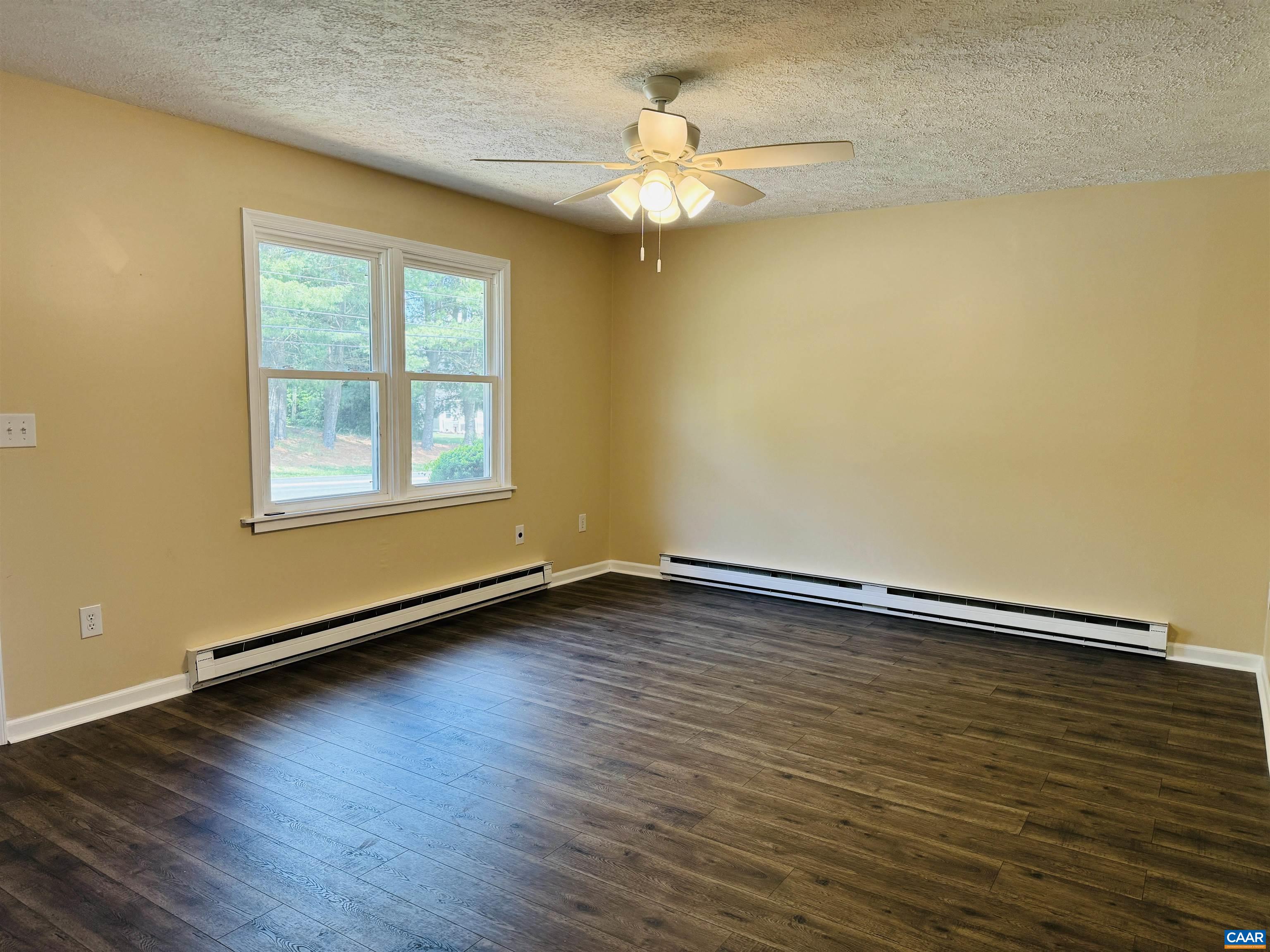 5000 White Bridge Road Waynesboro, VA 22980 - Photo 18 of 74 a view of an empty room with wooden floor and a window