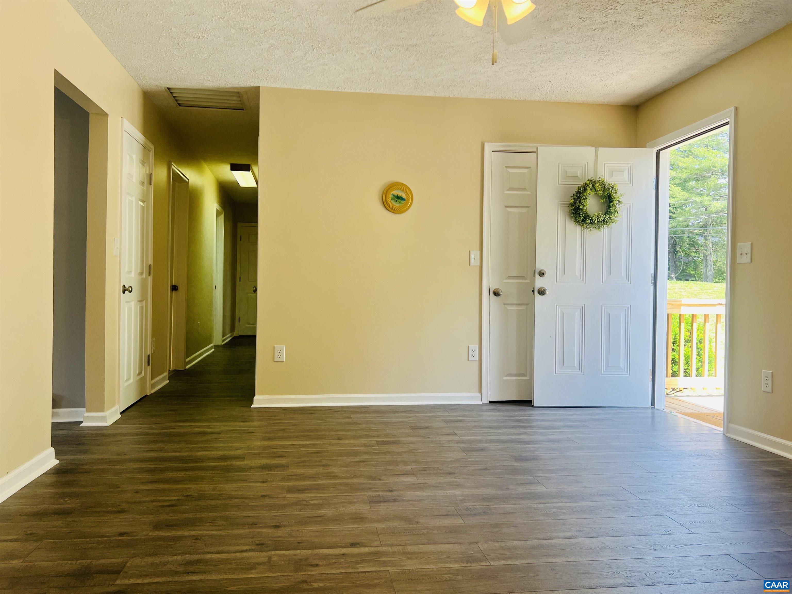 5000 White Bridge Road Waynesboro, VA 22980 - Photo 20 of 74 a view of a hallway with wooden floor and a cabinet