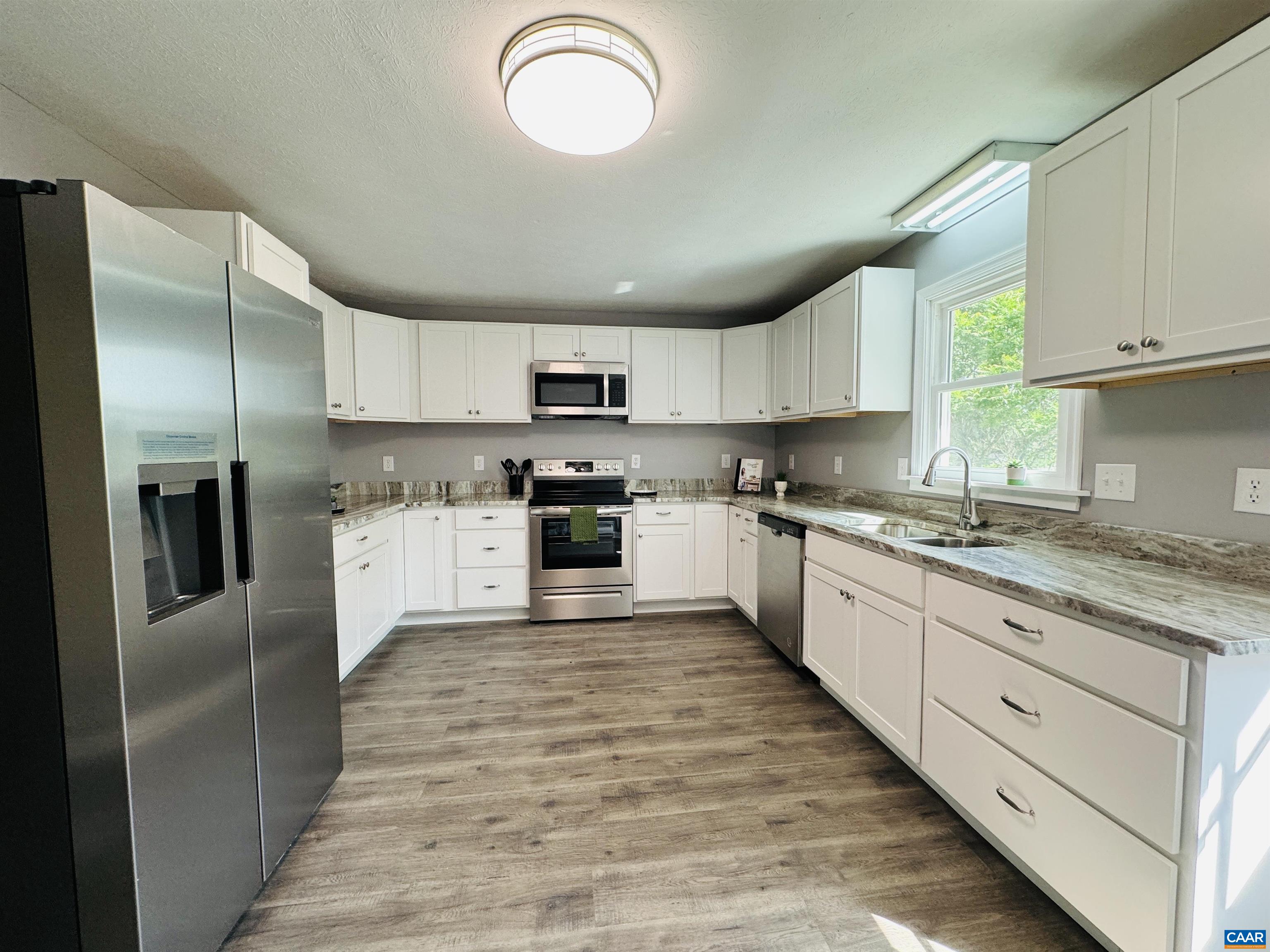 5000 White Bridge Road Waynesboro, VA 22980 - Photo 23 of 74 a large kitchen with cabinets stainless steel appliances and a window