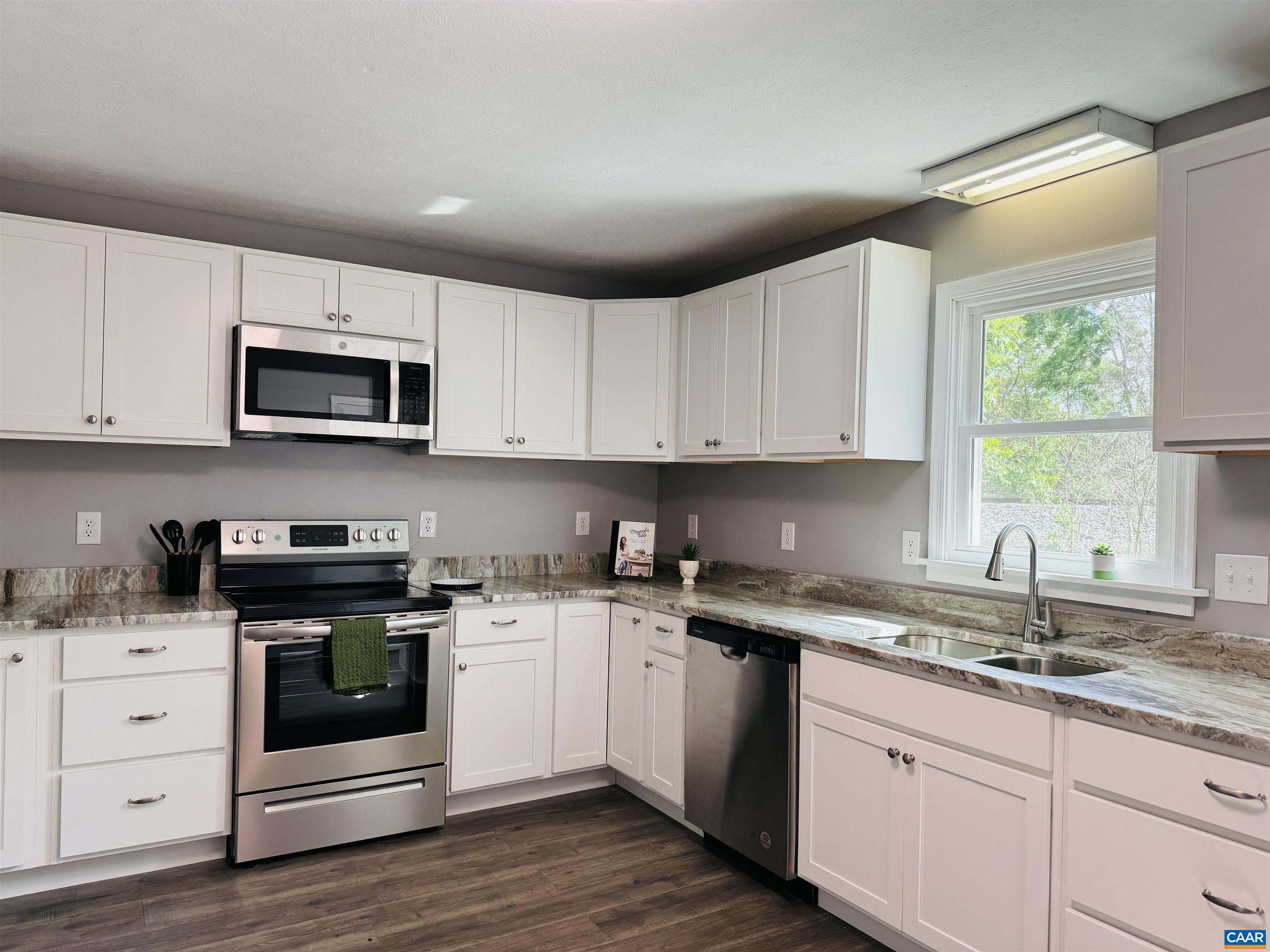 5000 White Bridge Road Waynesboro, VA 22980 - Photo 24 of 74 a kitchen with appliances a sink and a microwave