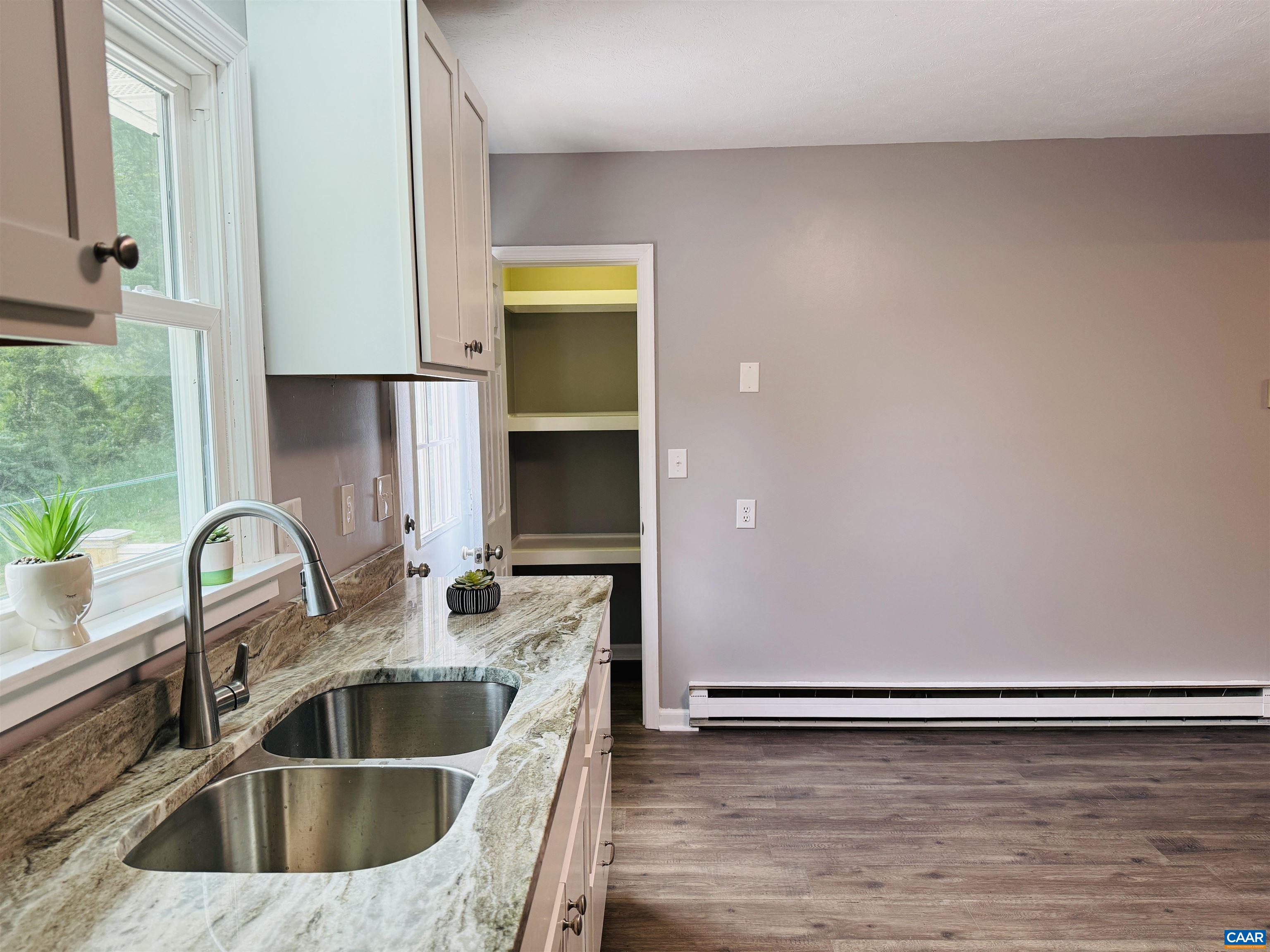 5000 White Bridge Road Waynesboro, VA 22980 - Photo 30 of 74 a kitchen with a sink and a stove top oven